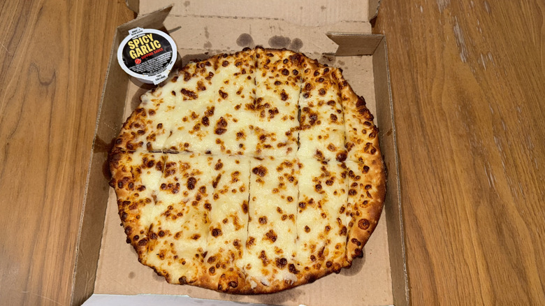 Papa John's Cheesesticks in a cardboard box.