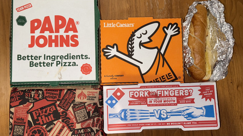 5 different cases of cheesy bread displayed on a wood surface.