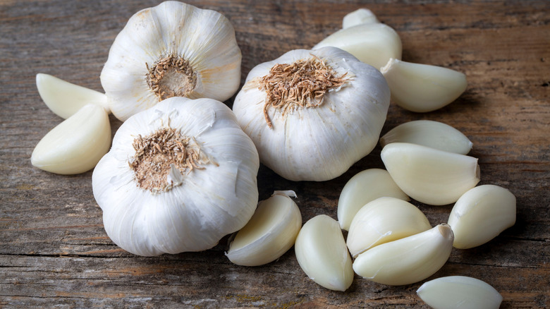 Garlic cloves on a wooden surface