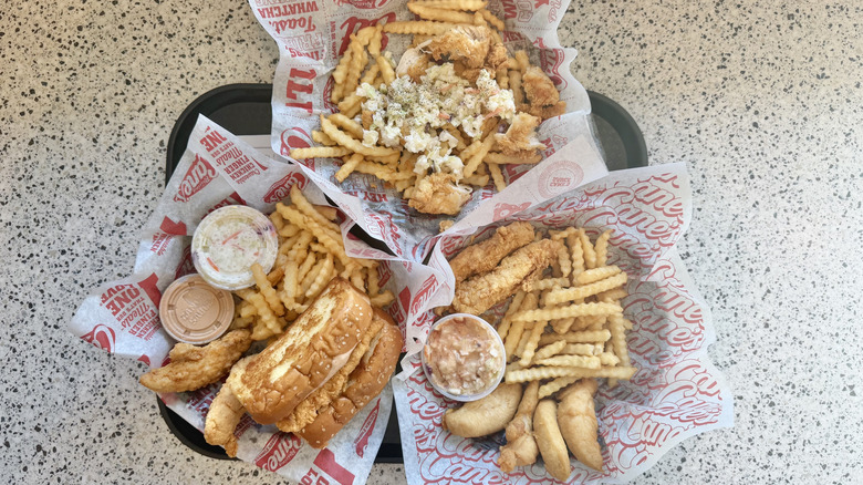 Top view of Raising Cane's fries, chicken, and coleslaw