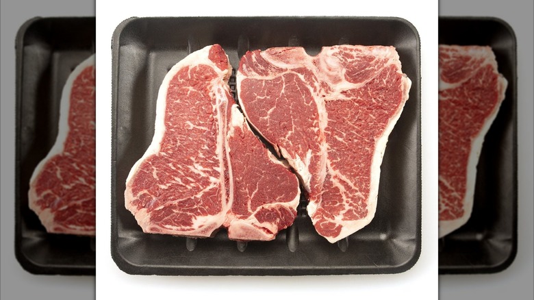 Two Sam's Club Member's Mark brand T-bone steaks on black tray
