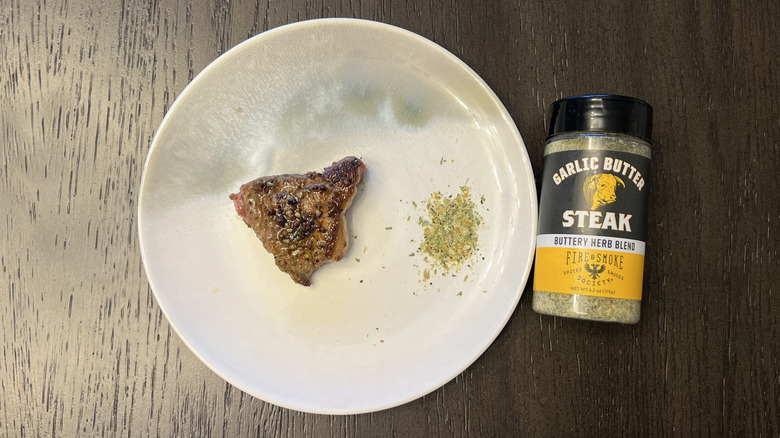 Fire & Smoke Society Garlic Butter Steak Buttery Herb Blend on steak cut