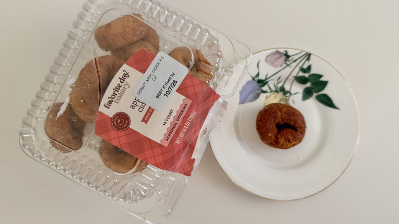 Favorite Day Apple Cider Mini Donut Tub and donut on a table