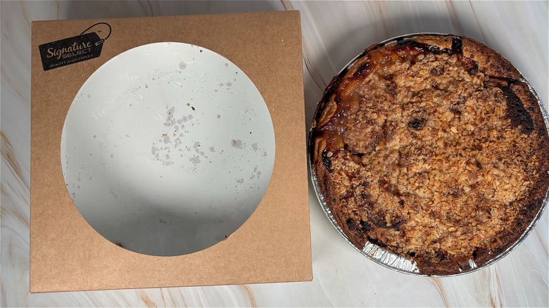 Top-down shot of Safeway apple pie next to box on table