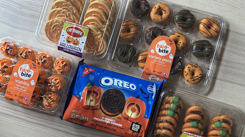 Baked Halloween treats arranged on wooden table