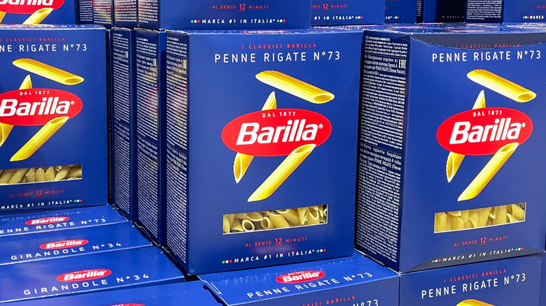Stacked boxes of Barilla brand penne rigate noodles