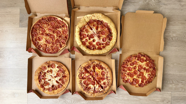 Top view of five pizzas from Pizza Hut