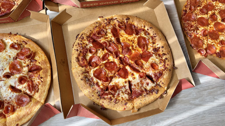 Sunlight view of pizzas on a table
