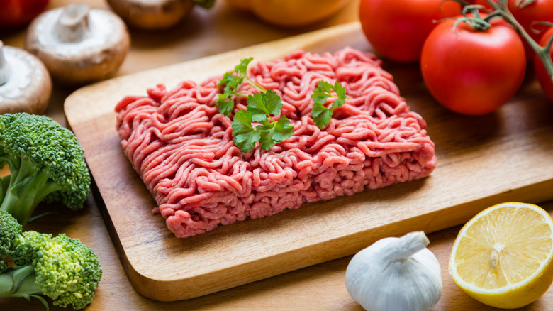 Uncooked ground beef with vegetables.