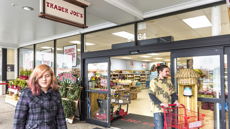 People walking by entrance of Trader Joe's