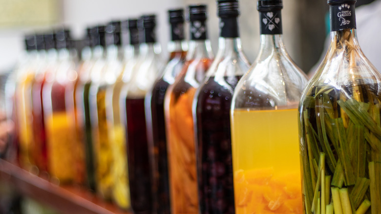 Shelf with bottles of infused spirits