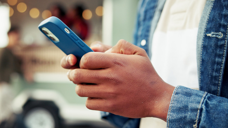 man holding cell phone