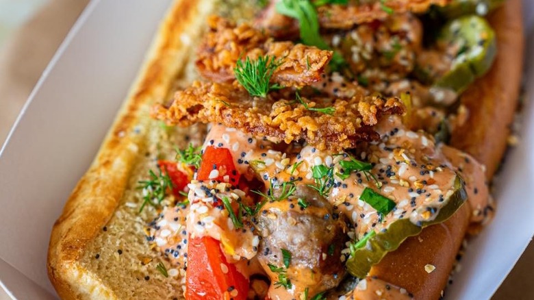 Hot chicken brat in a paper basket