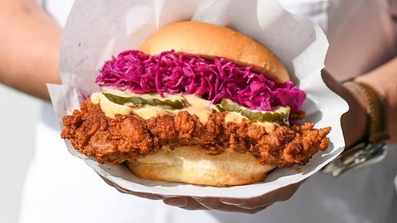 Person holding a chicken sandwich