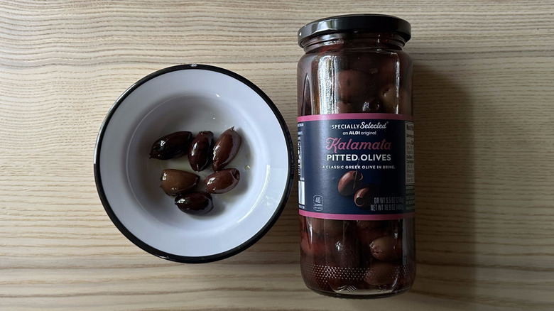 Specially Selected Kalamata Pitted Olives in white bowl