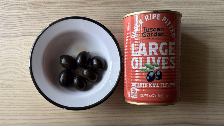 Tuscan Garden Black Ripe Pitted Large Olives in white bowl