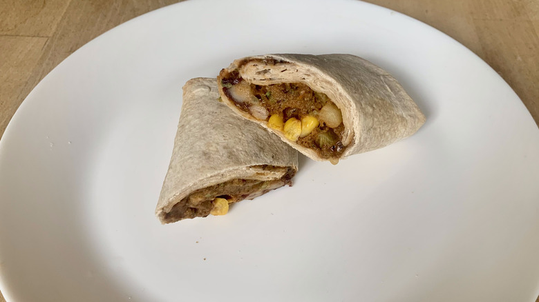 Amy's Black Bean Burrito cut in half on white plate