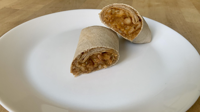 Amy's Non-Dairy Burrito cut in half on white plate