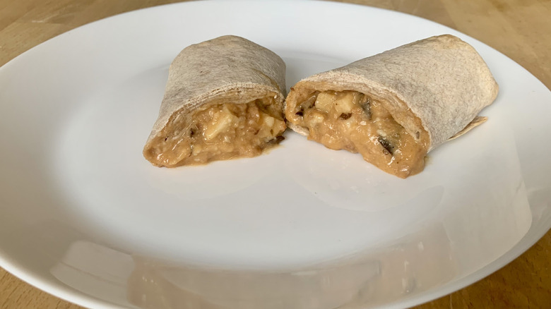 Amy's Southwestern Burrito cut in half on white plate
