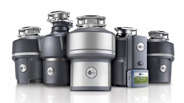 Several InSinkErator units on display on white background