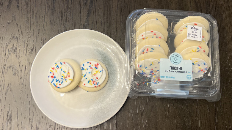 Kroger Bakery Fresh white frosted sugar cookies on plate.