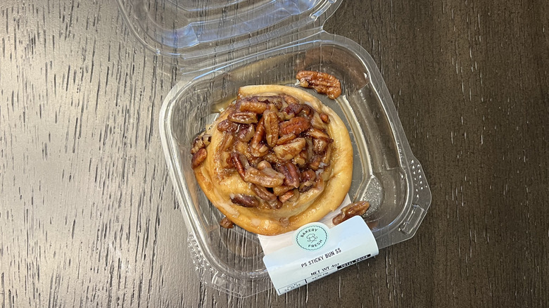 Kroger Bakery Fresh sticky bun in plastic container.