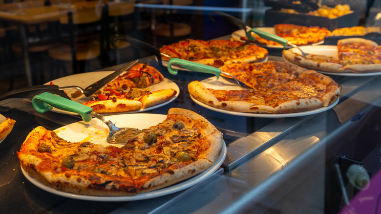 Several slices of pizza on white background