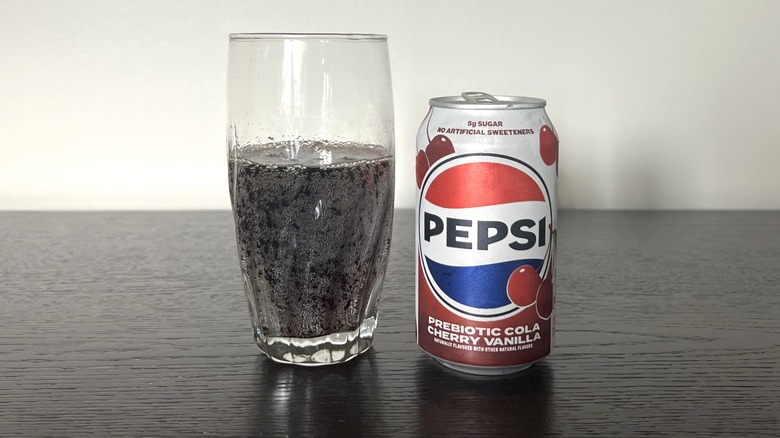 Pepsi Prebiotic Cola Cherry Vanilla poured into a glass.