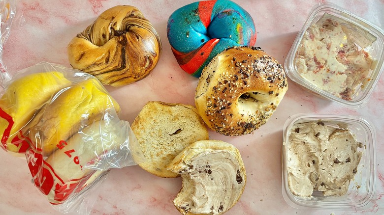 Array of bagels from Bagel Boss on pink surface