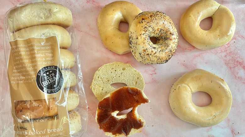 Array of bagels from Eli Zabar on pink surface
