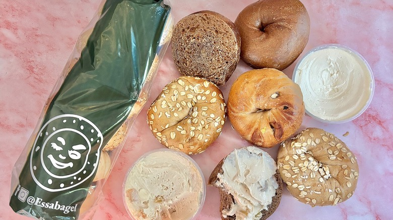 Array of bagels from Ess-a-bagel on pink surface