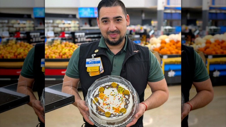 Walmart employee holding decorated cake