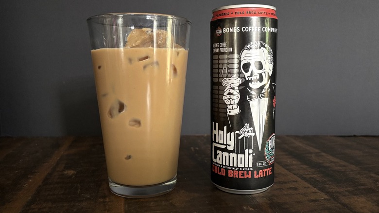 Bones Coffee Company Holy Cannoli RTD canned latte in glass with ice on wooden table