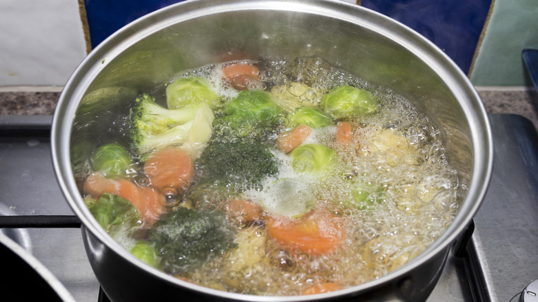 vegetables boiling in silver pot