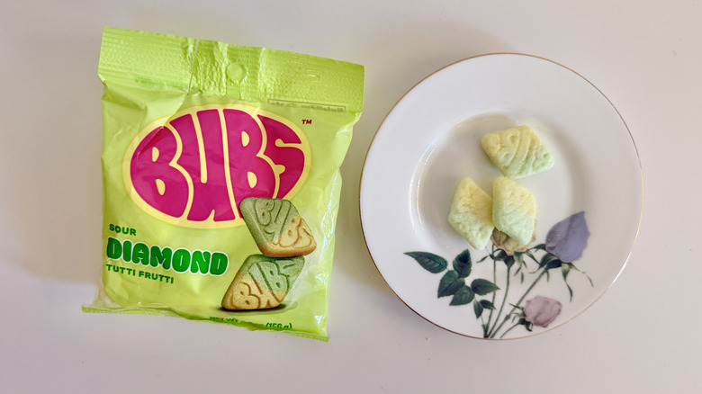 Three Sour Diamond Tutti Frutti pieces on a plate
