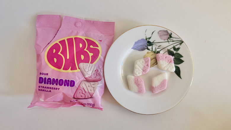 Four Sour Strawberry Vanilla Diamond pieces on a plate