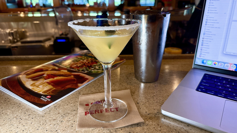 Margarita on a bar with a computer
