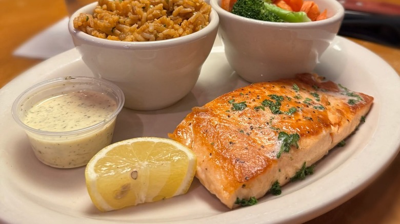 Grilled salmon with side of veggies and rice