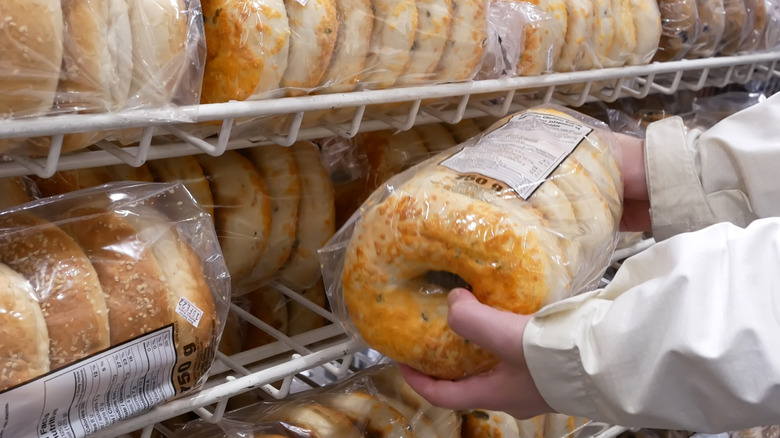 Close up of hands holding Costco bagel pack
