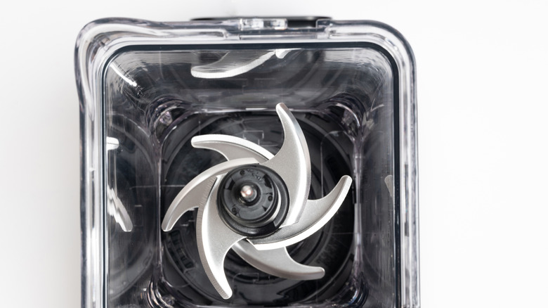 empty blender without lid from above on white background