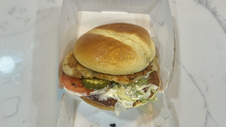 Culver's grilled chicken sandwich in to-go box.