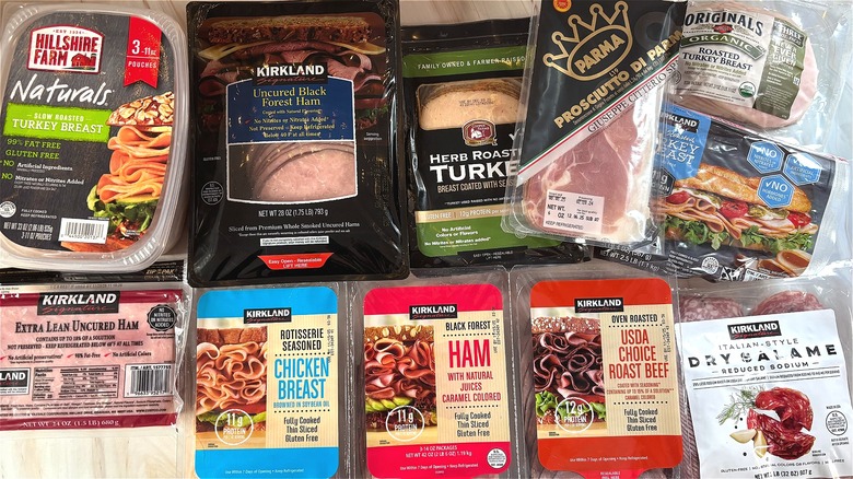 Top-down shot of various Costco deli meat packages on table