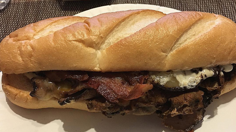 Angus three cheese and bacon on white plate