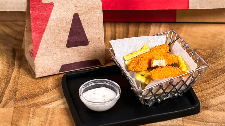 Arby's hushpuppy breaded fish strips on tray