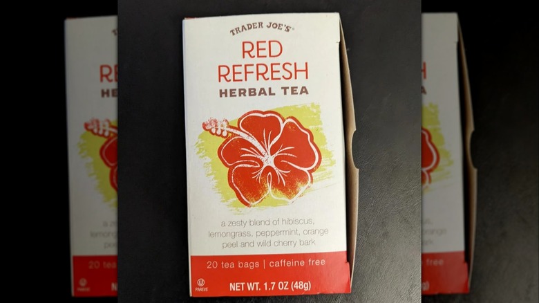Box of Red Refresh Herbal Tea on black background
