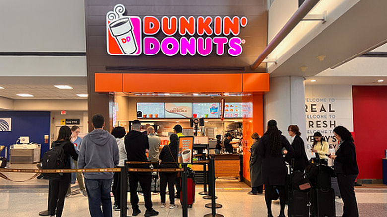 People in line for the Dunkin' Donuts at Newark Liberty International Airport