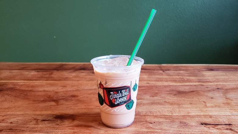 Dutch Bros Hopscotch protein mocha on a wood table.