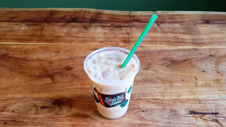 Dutch Bros Hopscotch protein latte on a wood table.