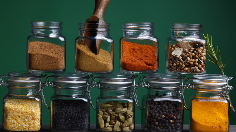 herbs and spices in glass jars