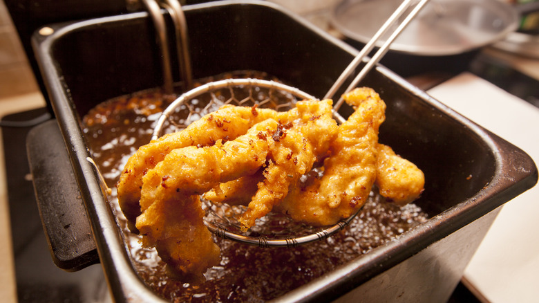 Deep-frying chicken in a deep-fryer